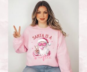 Santa Is A Swiftie Pink Christmas Blowing Bubble Sweatshirt, Taylor Album Merch, Pink Santa Christmas Tshirts, Merry Swiftmas, Ts Gift Fan.